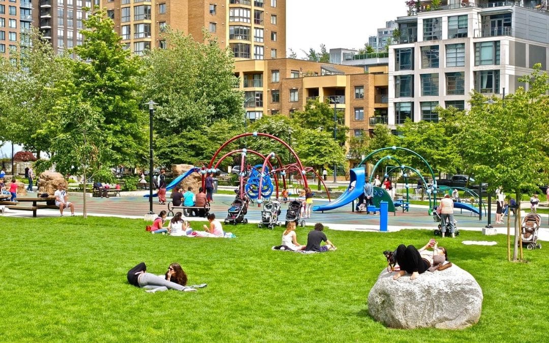 How can cities attract families with children to live downtown?